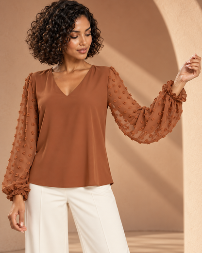 Blouse Élégance Aérienne – Col V et Manches Bouffantes en Voile Texturé